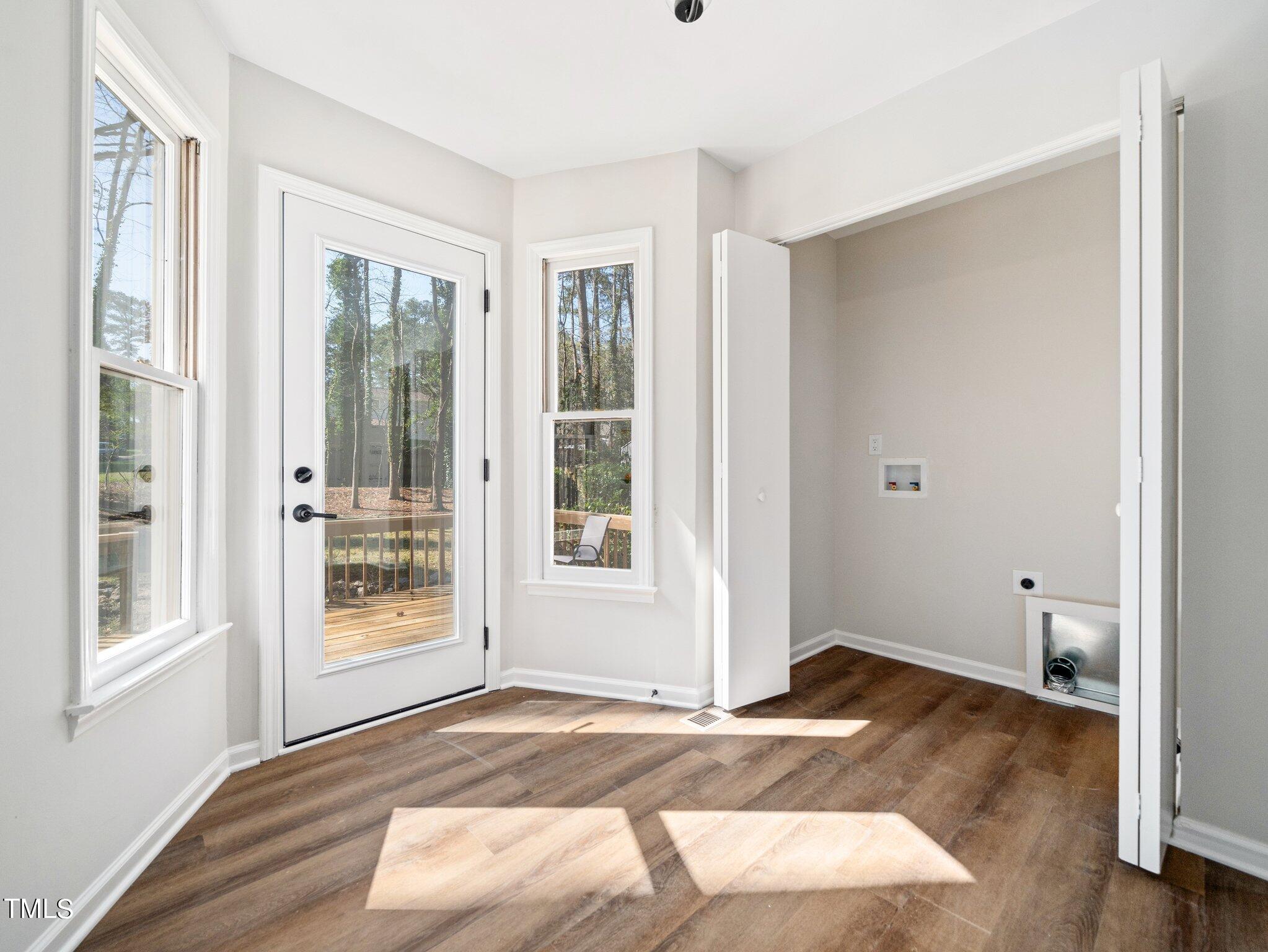 3512 Donna Road Raleigh, NC 27604 - Photo 15 of 28 a view of a livingroom with wooden floor and a window