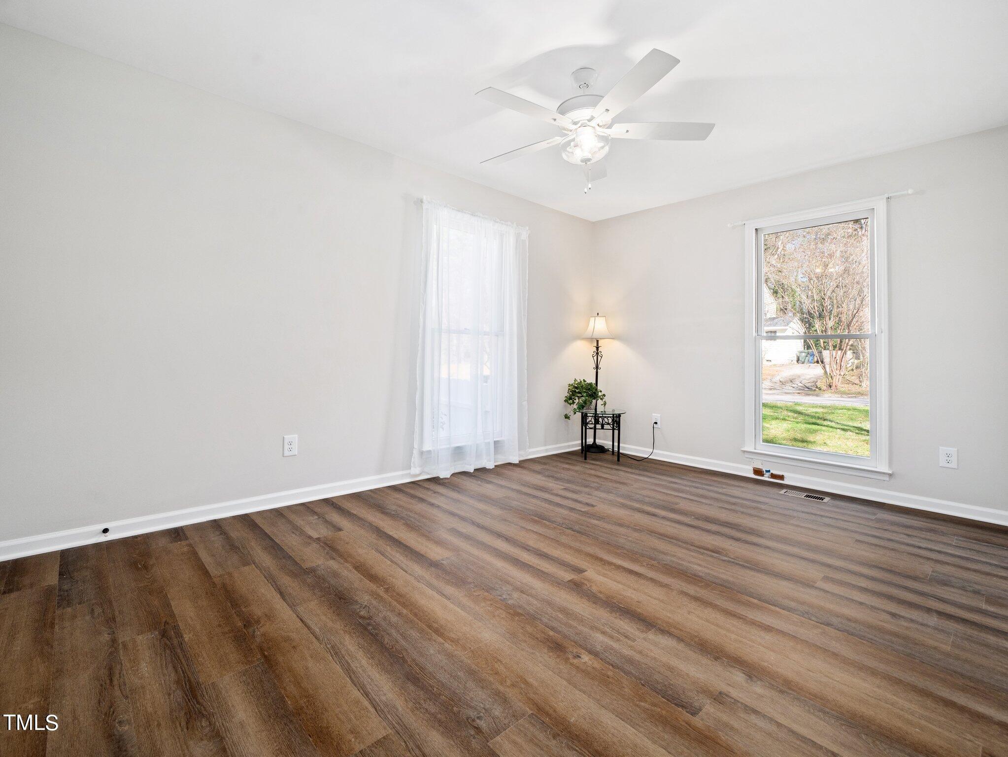 3512 Donna Road Raleigh, NC 27604 - Photo 16 of 28 wooden floor in an empty room with a window