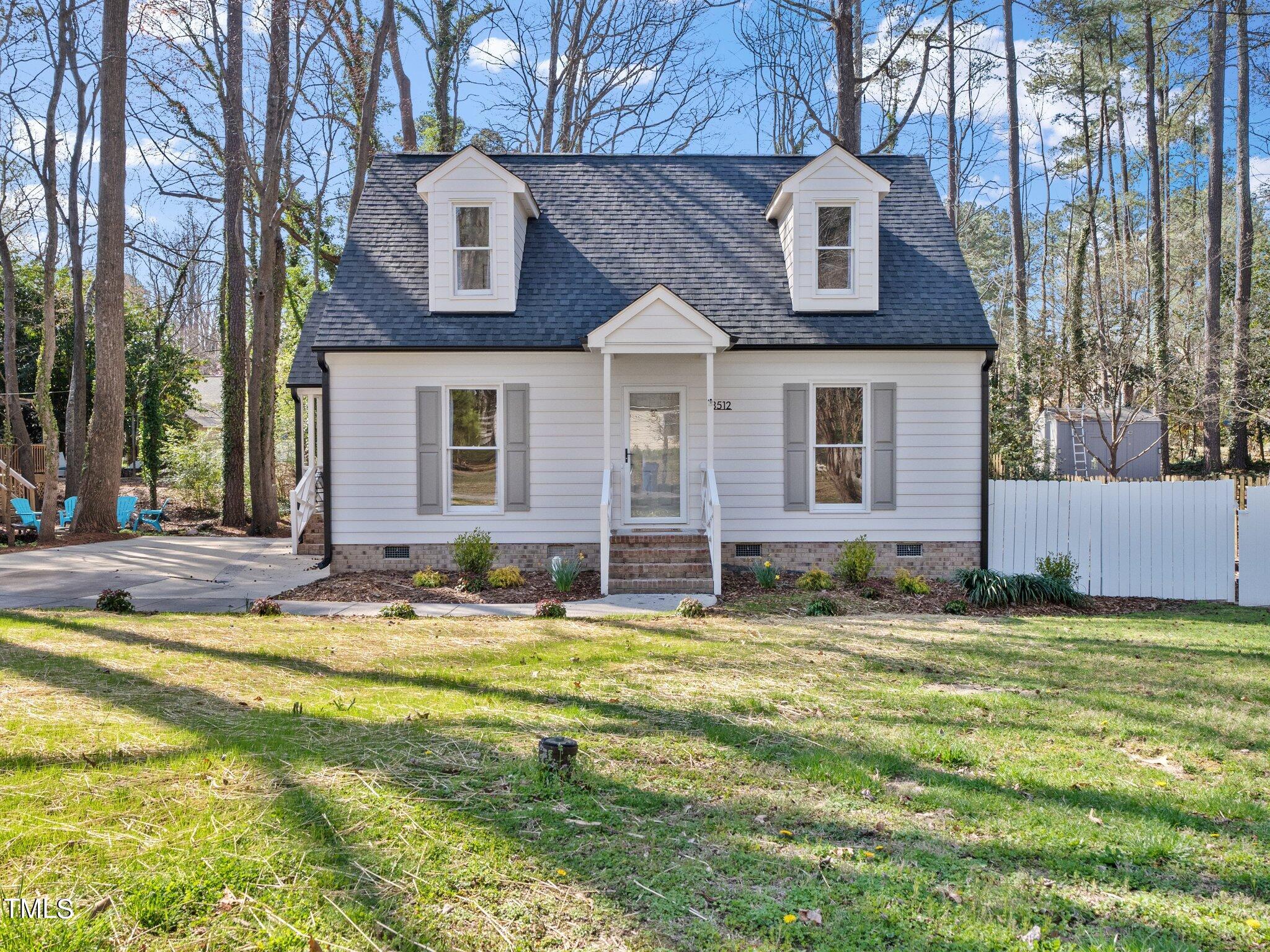 3512 Donna Road Raleigh, NC 27604 - Photo 4 of 28 a view of a house with a swimming pool