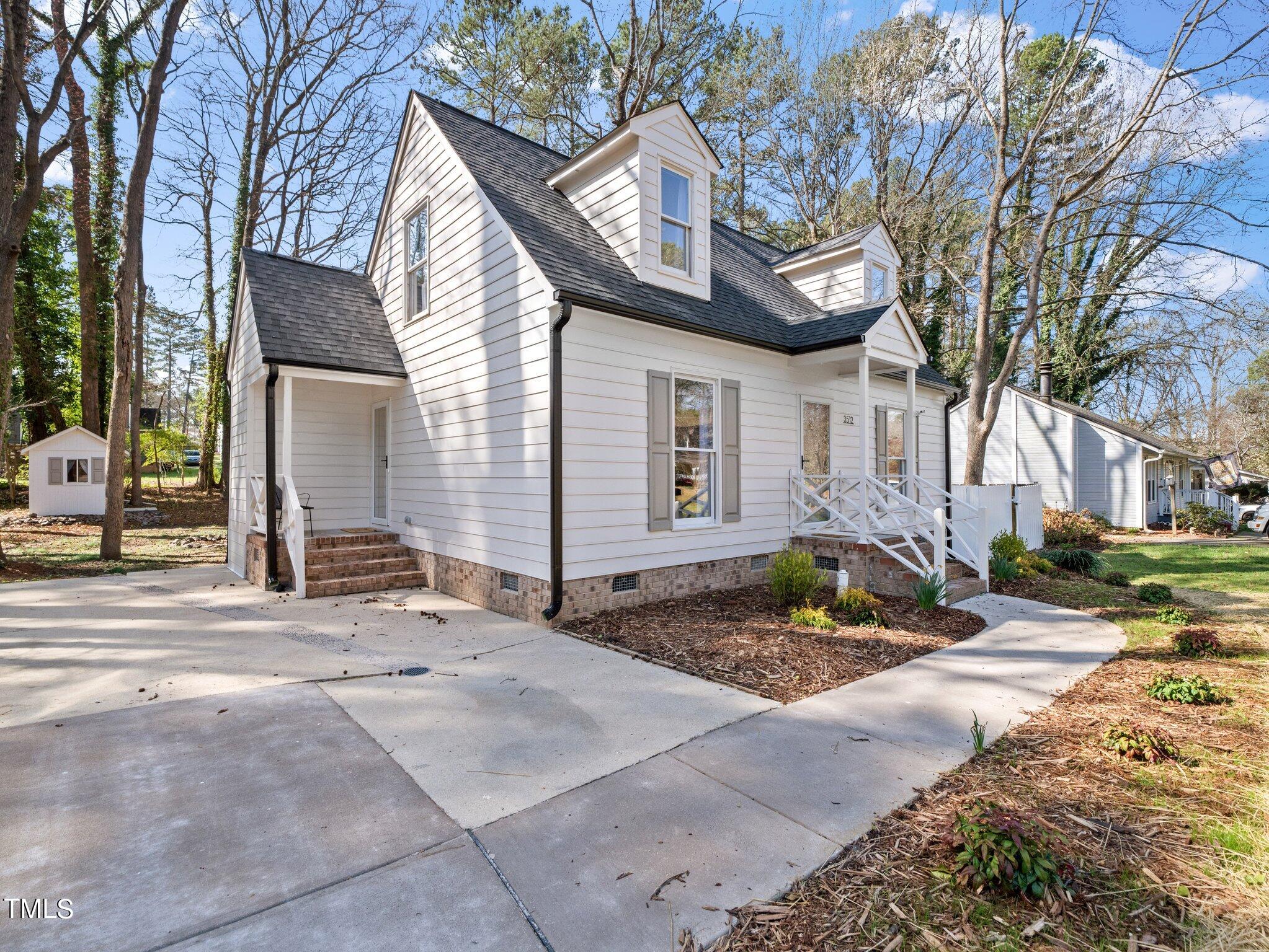 3512 Donna Road Raleigh, NC 27604 - Photo 5 of 28 a front view of a house with a yard
