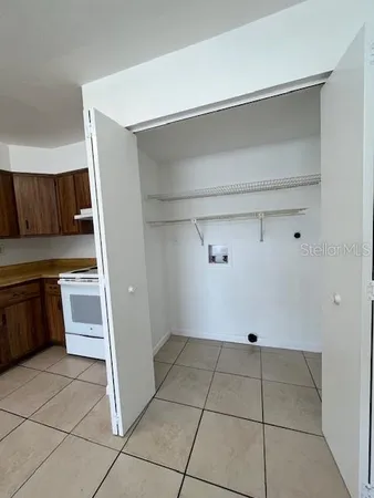 a view of an empty room and window