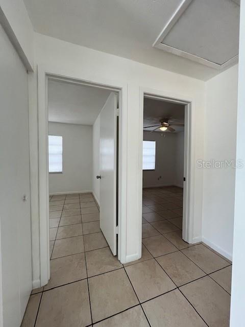1902 Northeast 17th Place Ocala, FL 34470 - Photo 18 of 28 a view of a hallway to rooms and stairs
