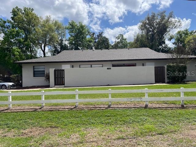 1902 Northeast 17th Place Ocala, FL 34470 - Photo 2 of 28 a front view of a house with a yard