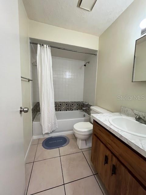 1902 Northeast 17th Place Ocala, FL 34470 - Photo 24 of 28 a spacious bathroom with a granite countertop sink a toilet and a mirror
