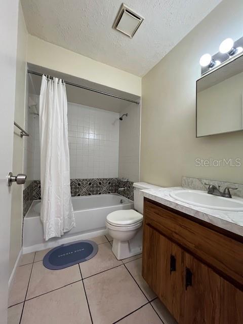 1902 Northeast 17th Place Ocala, FL 34470 - Photo 25 of 28 a bathroom with a granite countertop sink mirror vanity and toilet