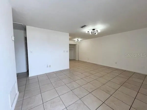 a view of kitchen with stainless steel appliances cabinets and a counter top space