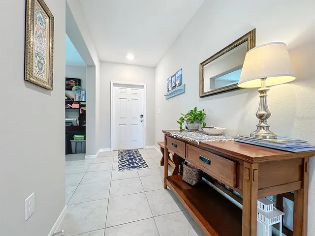 a kitchen with stainless steel appliances granite countertop wooden cabinets a sink a stove and a refrigerator