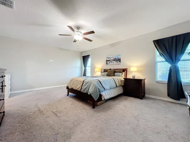 a bathroom with double sink and a mirror