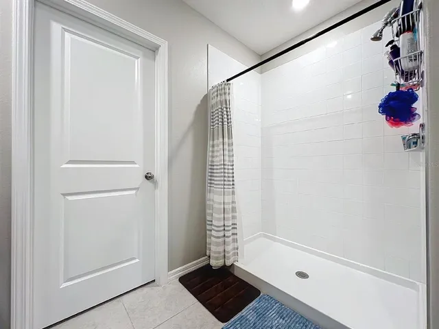 a view of room with window and cabinet