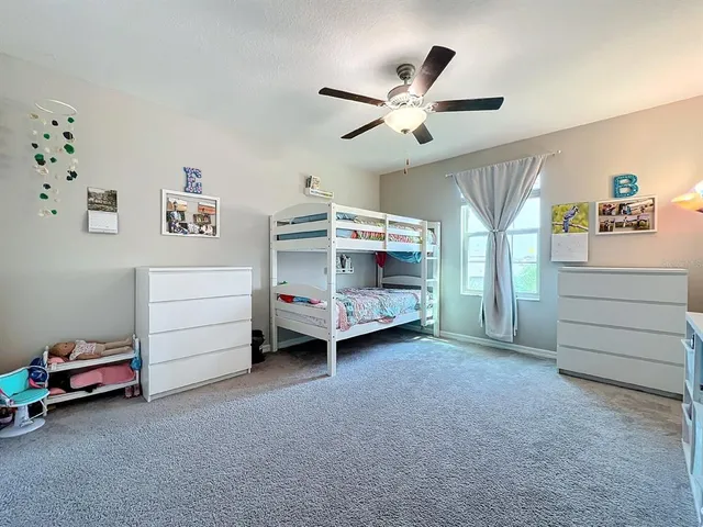 a white toilet sitting next to a shower curtain