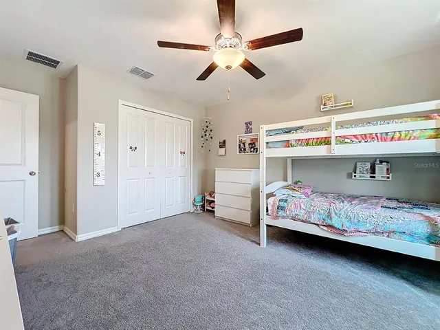 a utility room with dryer washer and a view of living room