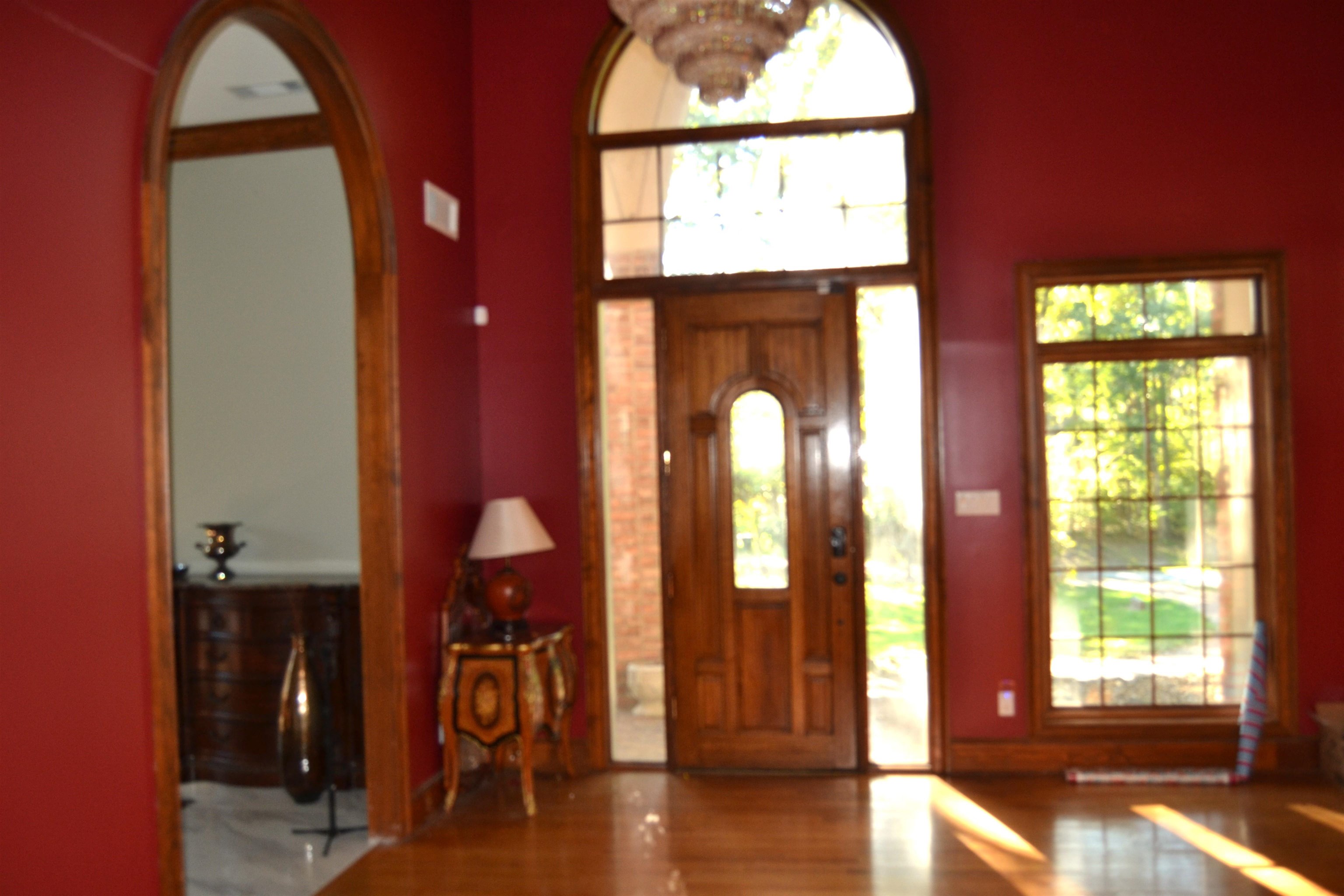 470 Walnut Point Cove Memphis, TN 38018 - Photo 11 of 37 Foyer featuring wood finished floors and a chandelier