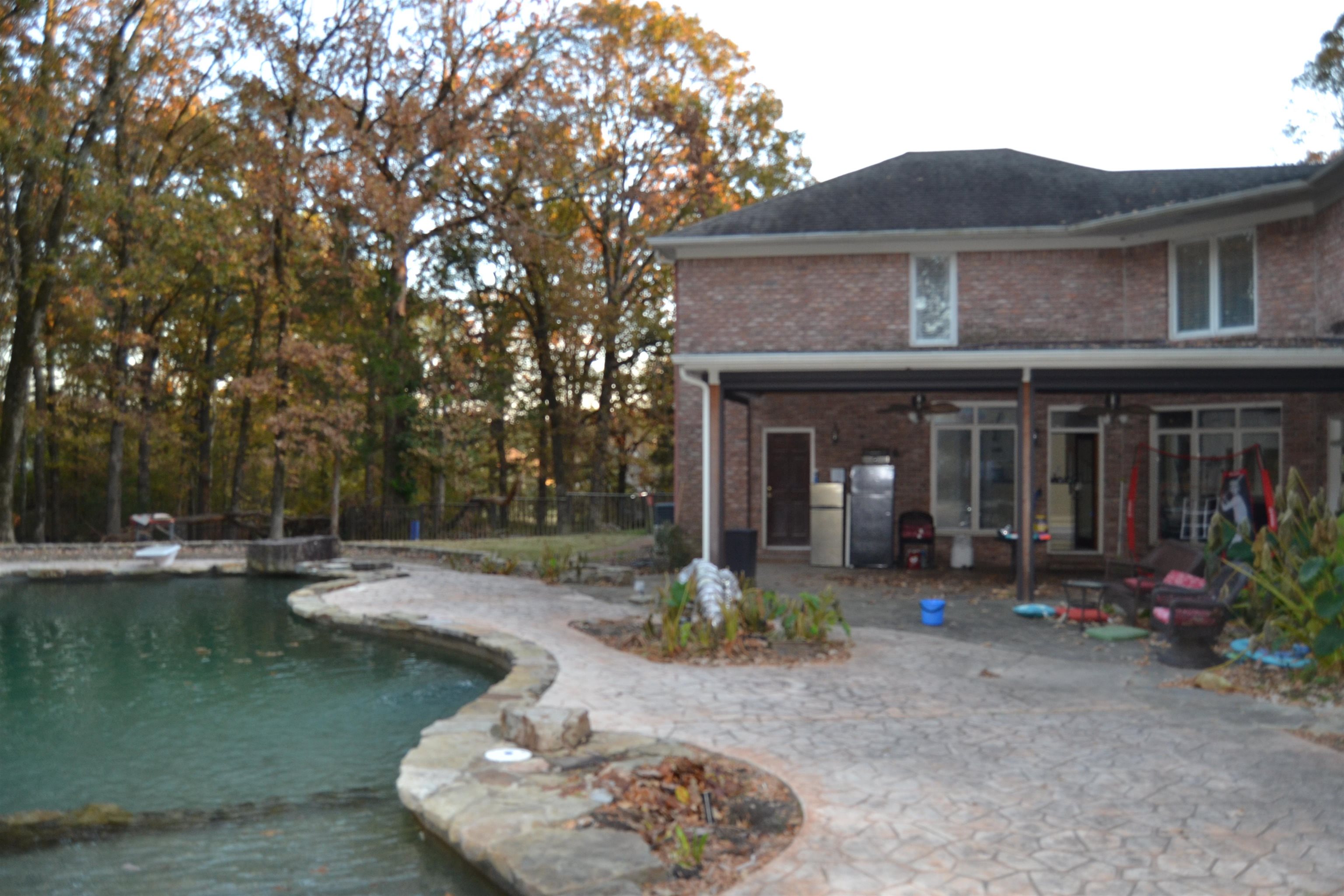 470 Walnut Point Cove Memphis, TN 38018 - Photo 26 of 37 Back of property featuring a patio, a ceiling fan, brick siding, and an outdoor pool