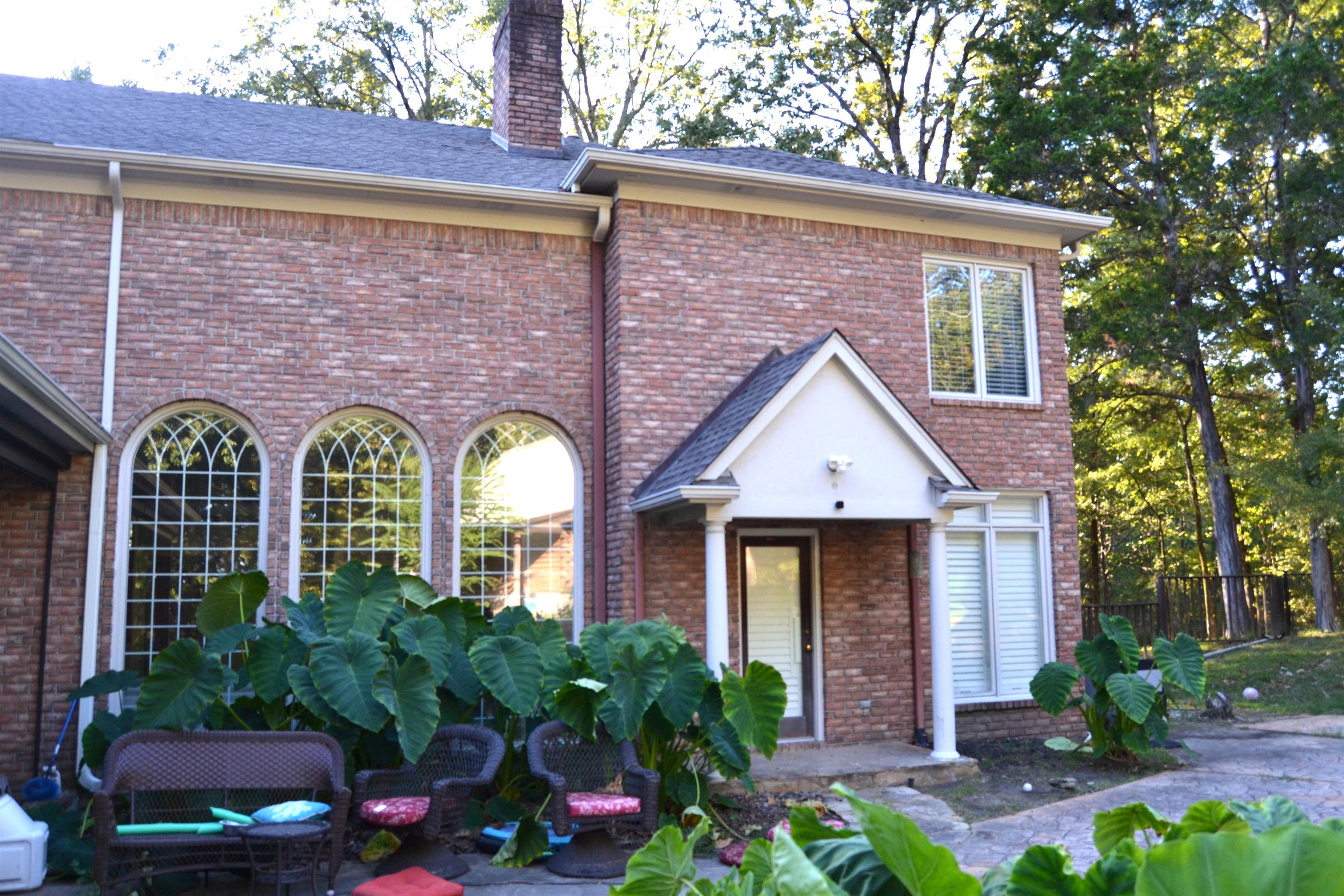 470 Walnut Point Cove Memphis, TN 38018 - Photo 27 of 37 View of rear of house with brick siding, a chimney, and roof with shingles