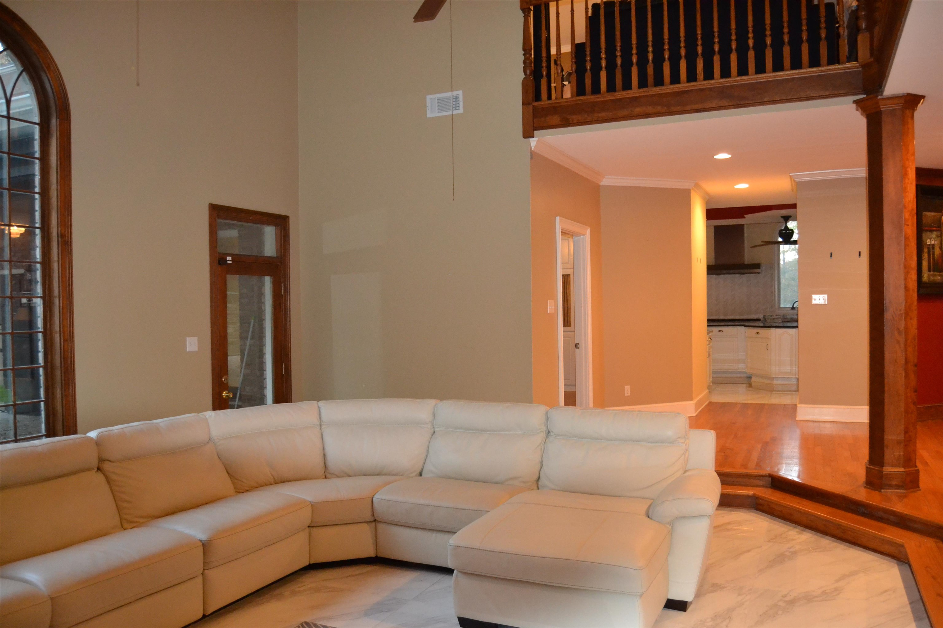 470 Walnut Point Cove Memphis, TN 38018 - Photo 7 of 37 Living area with a ceiling fan, marble finish flooring, ornate columns, recessed lighting, and ornamental molding