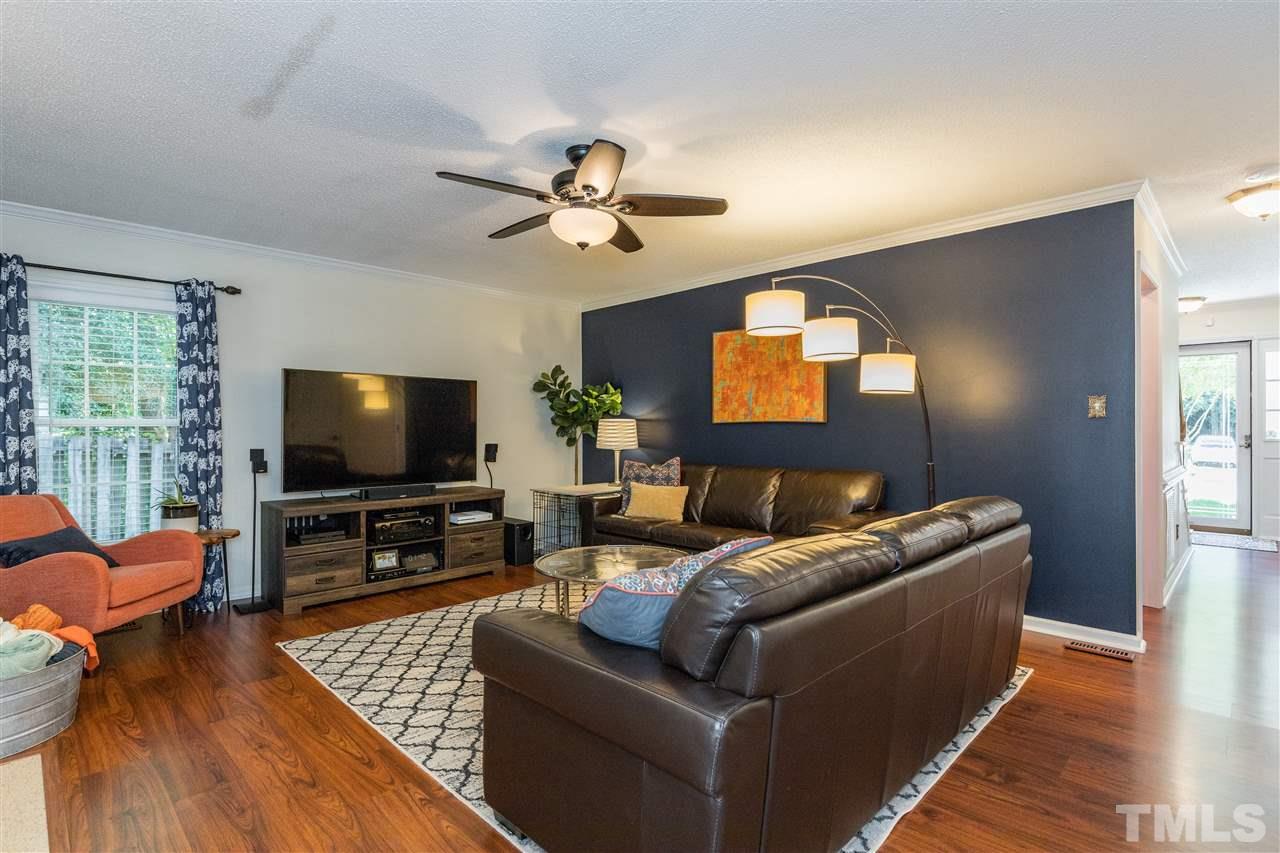 6004 Dedmon Place Raleigh, NC 27616 - Photo 11 of 30 a living room with furniture and a flat screen tv