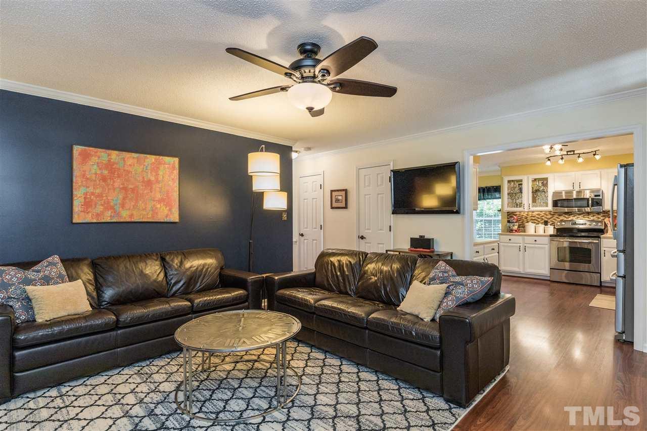 6004 Dedmon Place Raleigh, NC 27616 - Photo 12 of 30 a living room with furniture and a flat screen tv