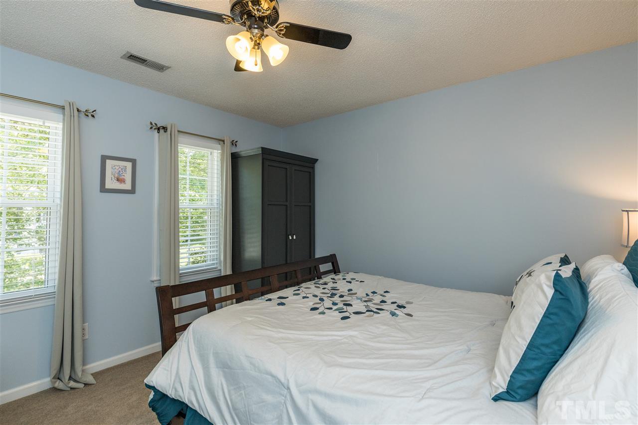 6004 Dedmon Place Raleigh, NC 27616 - Photo 22 of 30 a bedroom with a bed and a window