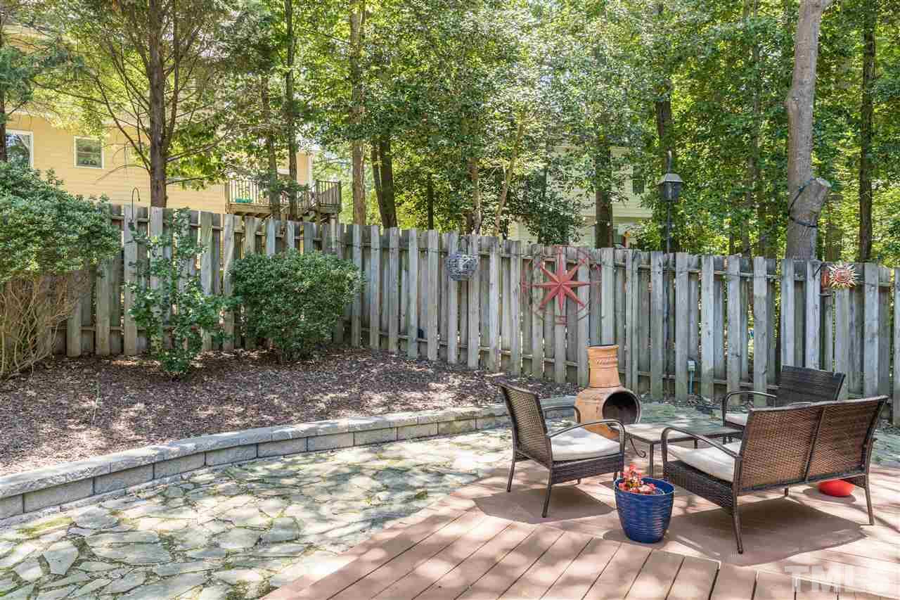 6004 Dedmon Place Raleigh, NC 27616 - Photo 27 of 30 a view of a backyard with chairs and a fire pit