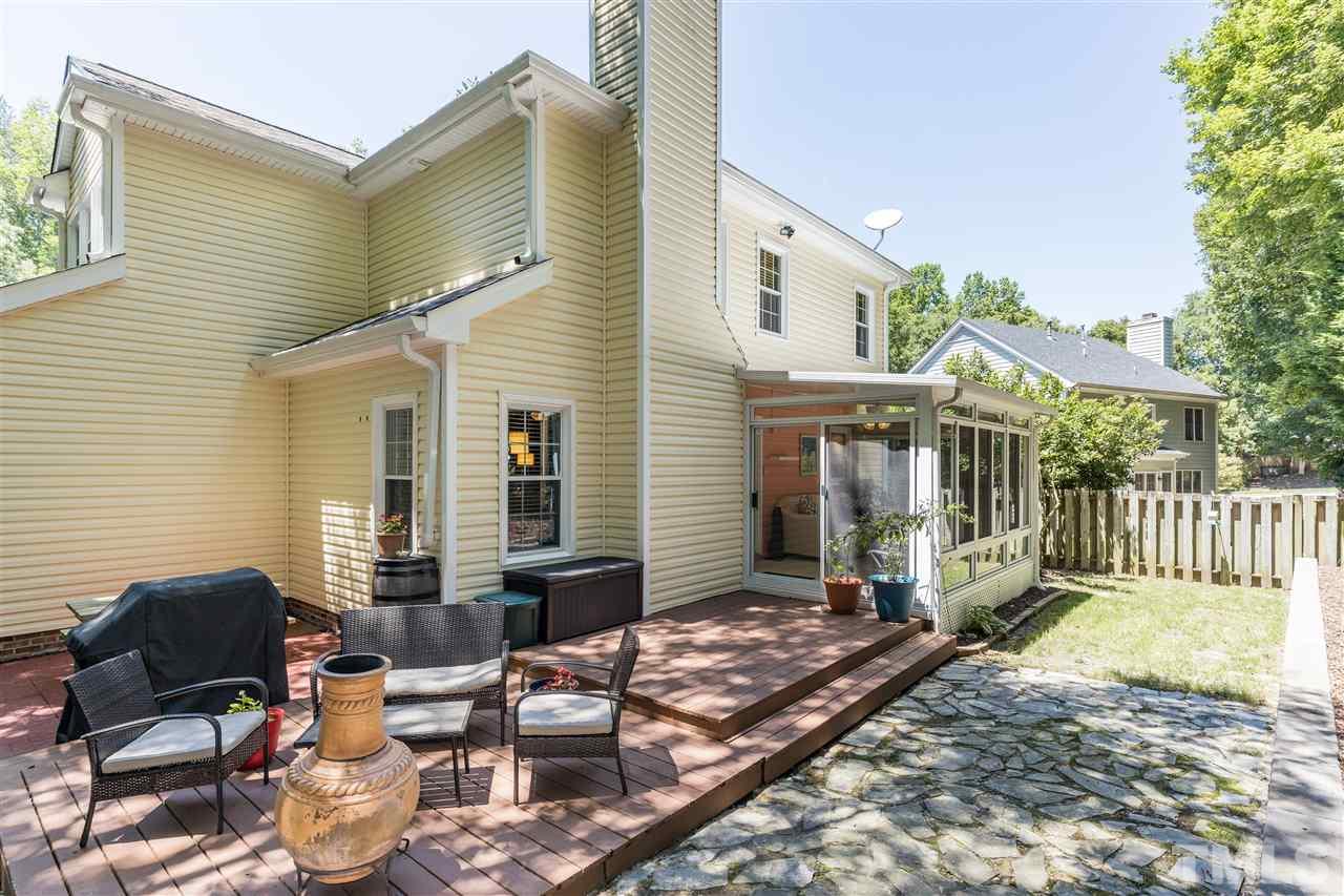 6004 Dedmon Place Raleigh, NC 27616 - Photo 29 of 30 a backyard of a house with barbeque oven table and chairs