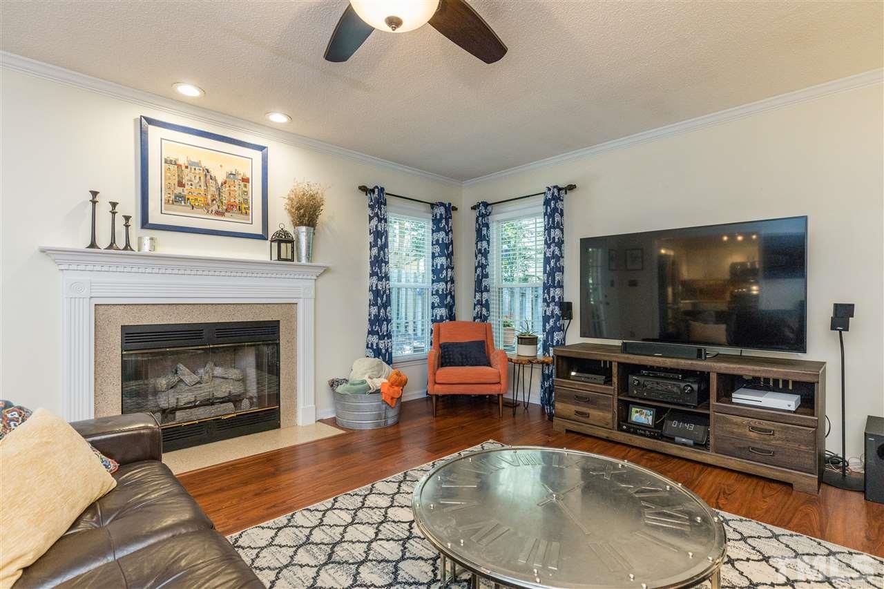 6004 Dedmon Place Raleigh, NC 27616 - Photo 10 of 30 a living room with furniture and a fireplace