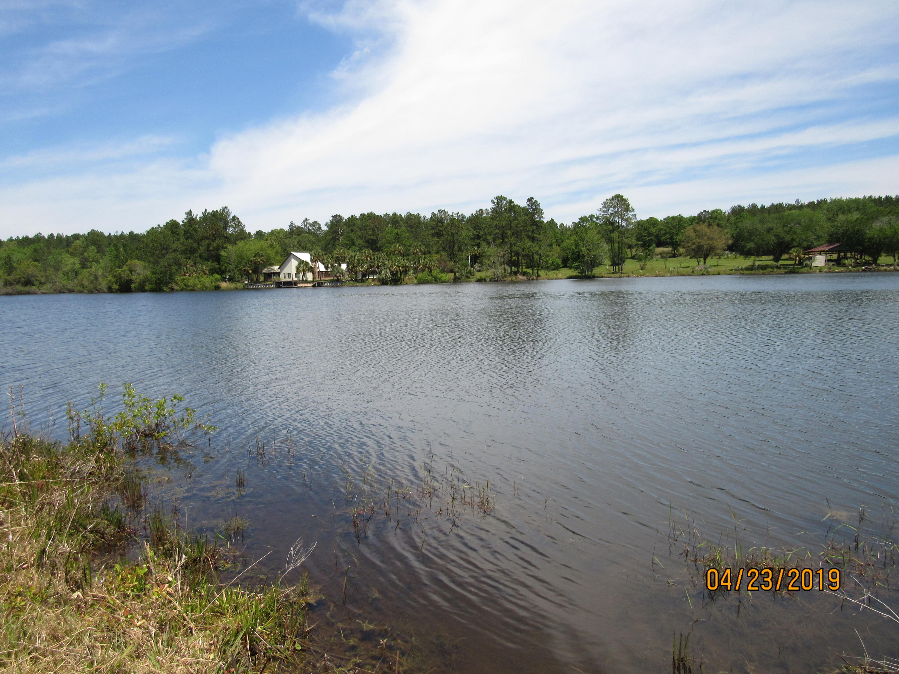 17-ac Old River Road Baker, FL 32531 - Photo 4 of 7 a view of a lake with houses in the back