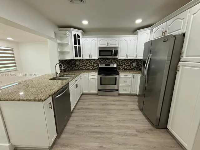 a front view of house with yard and outdoor seating