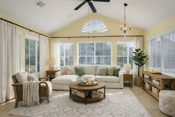 a living room with furniture and a large window