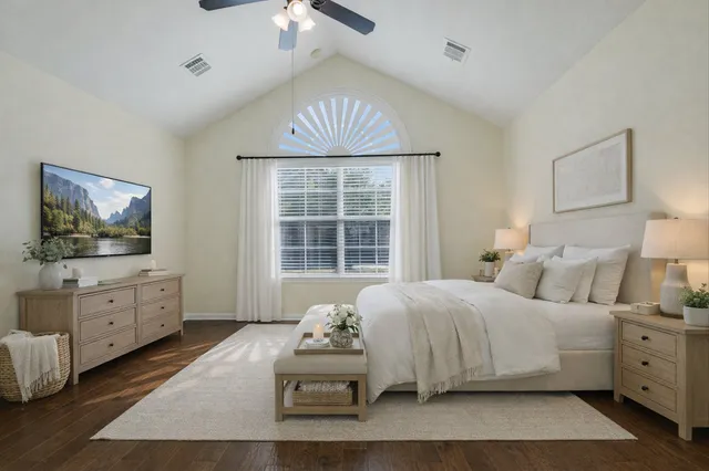 a bedroom with a bed and window