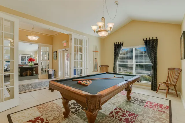 a pool table sitting in the middle of a room
