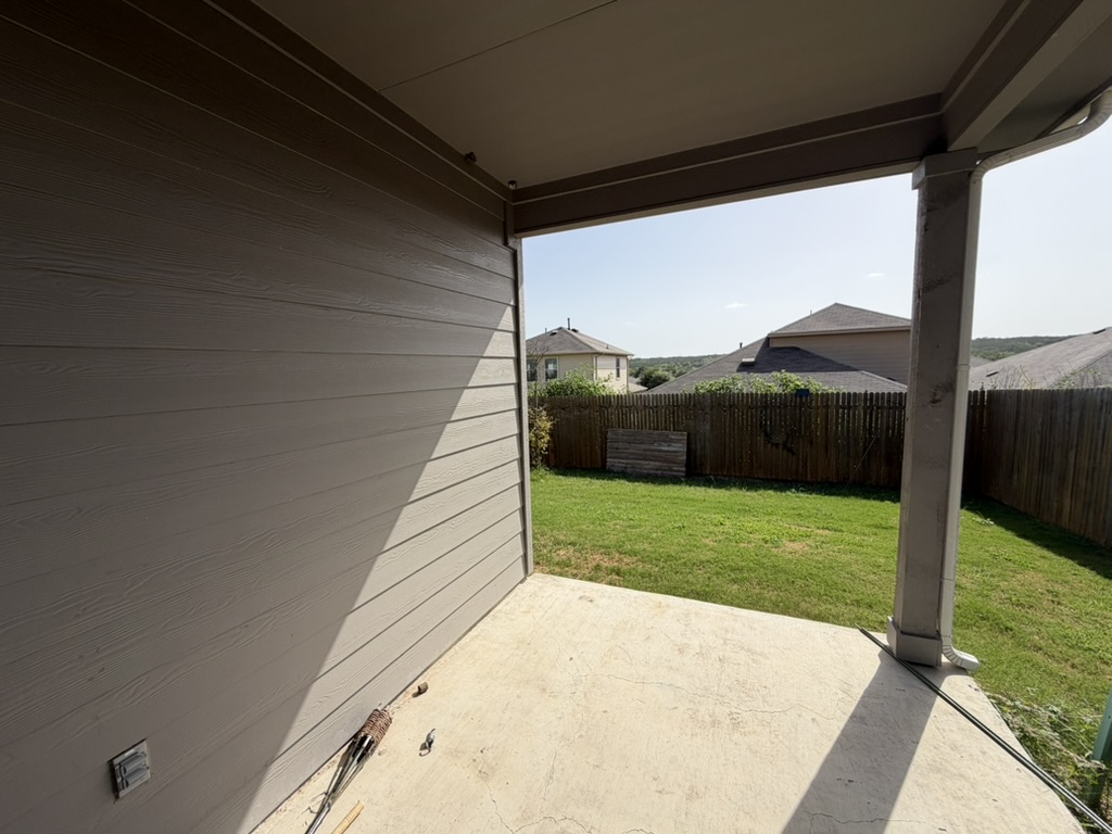 10708 Gonzales Ranger Pass Austin, TX 78754 - Photo 37 of 40 An inviting covered patio opens to a well-maintained yard.
