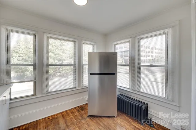 a kitchen with a window a refrigerator and a sink
