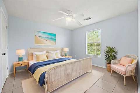 a bedroom with a large bed and a couch