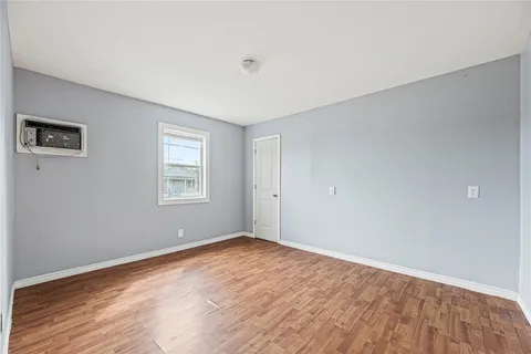 a bedroom with a bed table closet and a couch