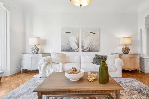 a stove sitting inside of a kitchen with granite countertop wooden cabinets