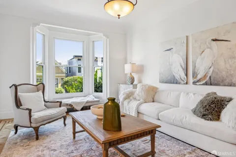 a kitchen with sink stove and cabinets