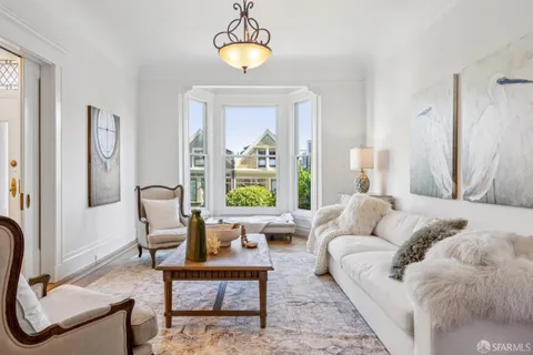 a view of a hallway with seating area