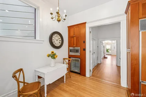 a bedroom with a bed and a large mirror on dresser