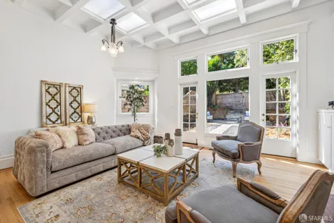 a view of a room with wooden floor and windows