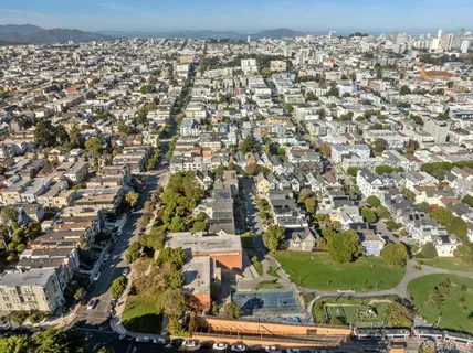 a living room with furniture a table and chairs