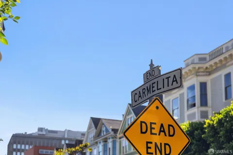 a living room with fireplace furniture and a chandelier