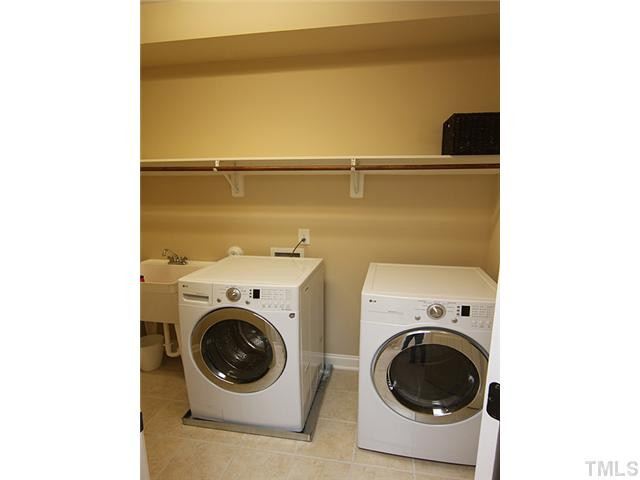 12924 Edsel Drive Raleigh, NC 27613 - Photo 20 of 25 Look at the size of this laundry room!! -plus, please notice the extra storage,wash sink and tiled floors. Laundry Room