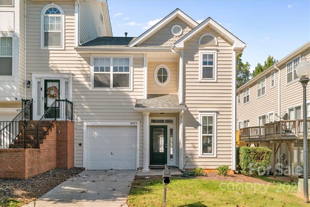 6323 Gammon Road Charlotte, NC 28269 - Photo 1 of 28 a front view of a house with a yard