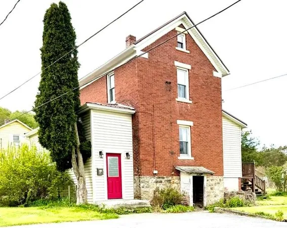 a front view of a house with yard