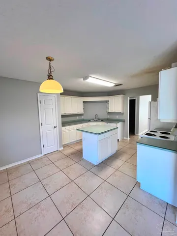 a kitchen with stainless steel appliances a sink and a stove