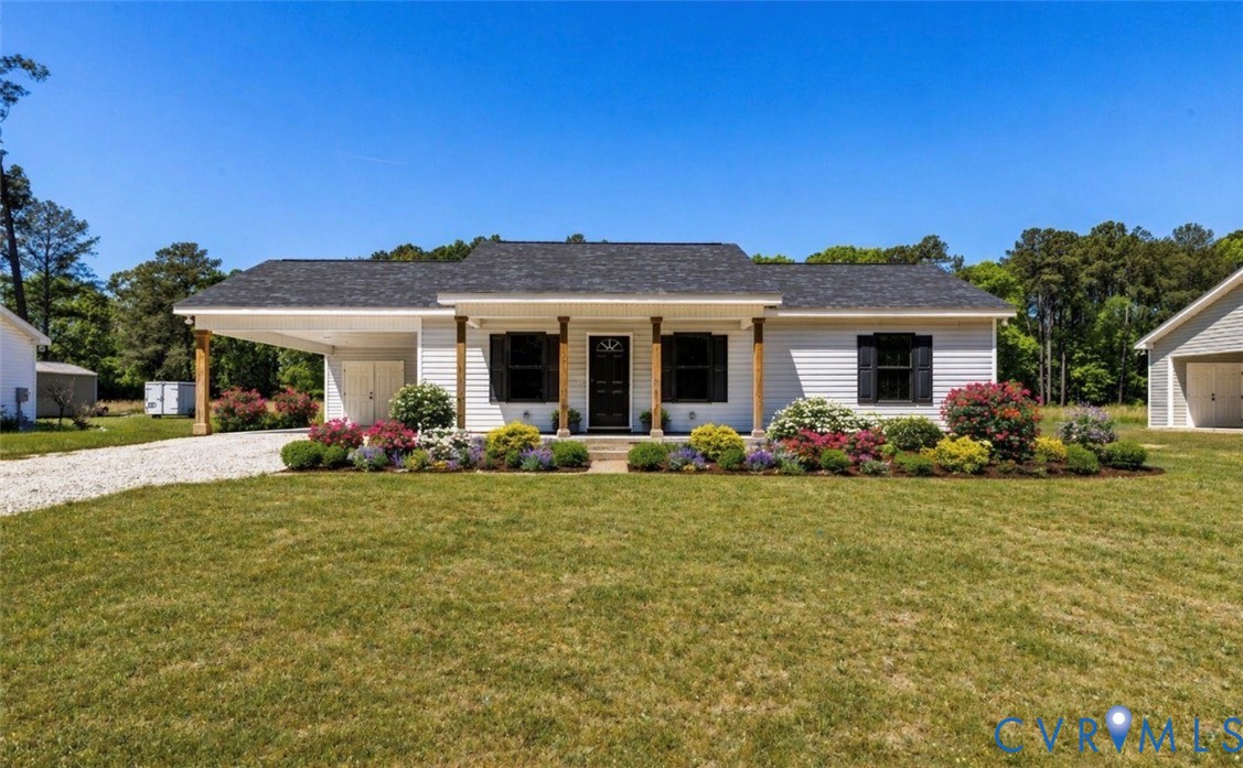 a front view of a house with yard patio and fire pit