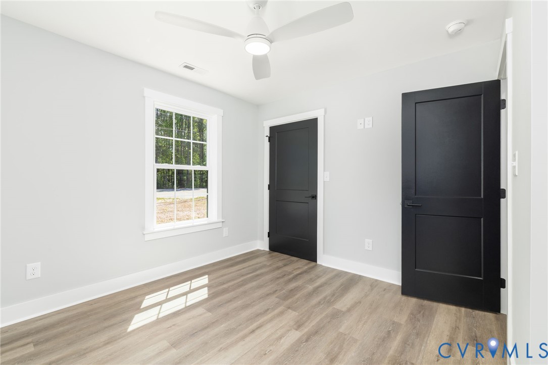 2085 Skippers Road Emporia, VA 23847 - Photo 11 of 34 an empty room with windows and closet