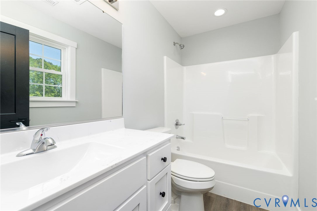 2085 Skippers Road Emporia, VA 23847 - Photo 13 of 34 a bathroom with a sink a toilet and a bathtub