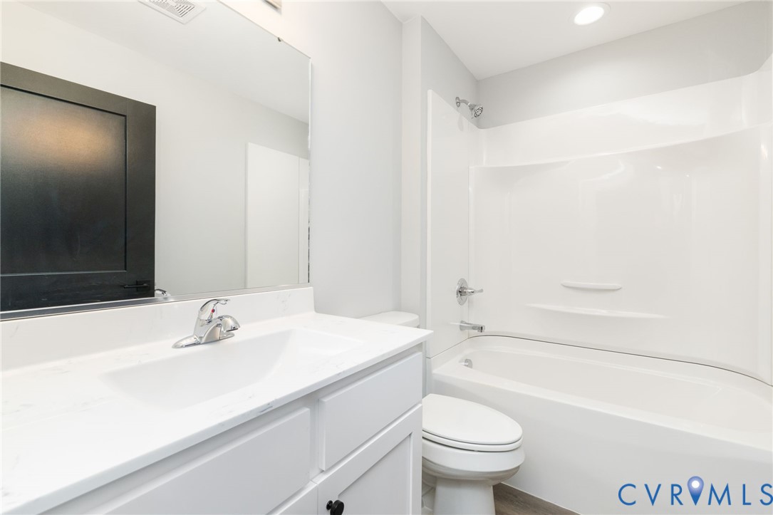 2085 Skippers Road Emporia, VA 23847 - Photo 14 of 34 a bathroom with a sink a toilet and a bathtub