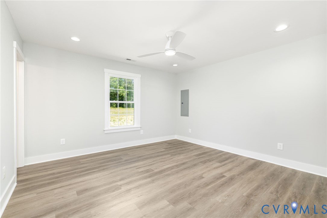 2085 Skippers Road Emporia, VA 23847 - Photo 16 of 34 wooden floor in an empty room with a window